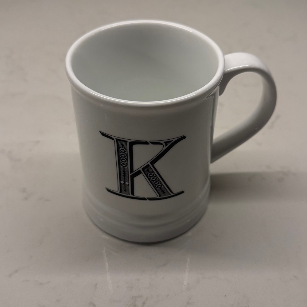 Schurman Retail Group “K” Initial White Monogrammed Mug with Black Lettering